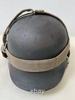 WW2 German Army Combat Helmet M35 Sz 62, Camo Paint withLiner. Orig