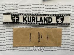 Bande de poignet de vétéran de la Bundeswehr allemande de la Seconde Guerre mondiale 1957 Kurland avec sac