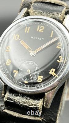 Montre militaire vintage HELIOS DH de l'armée allemande Wehrmacht WWII, révisée, RARE